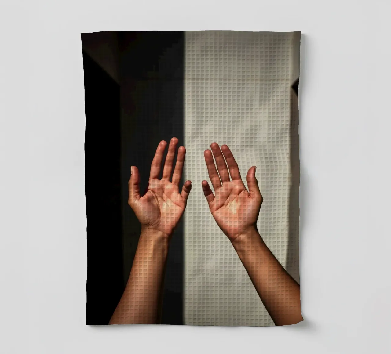Hands reaching towards light in a minimalist setting tea towel by DesignDoodle