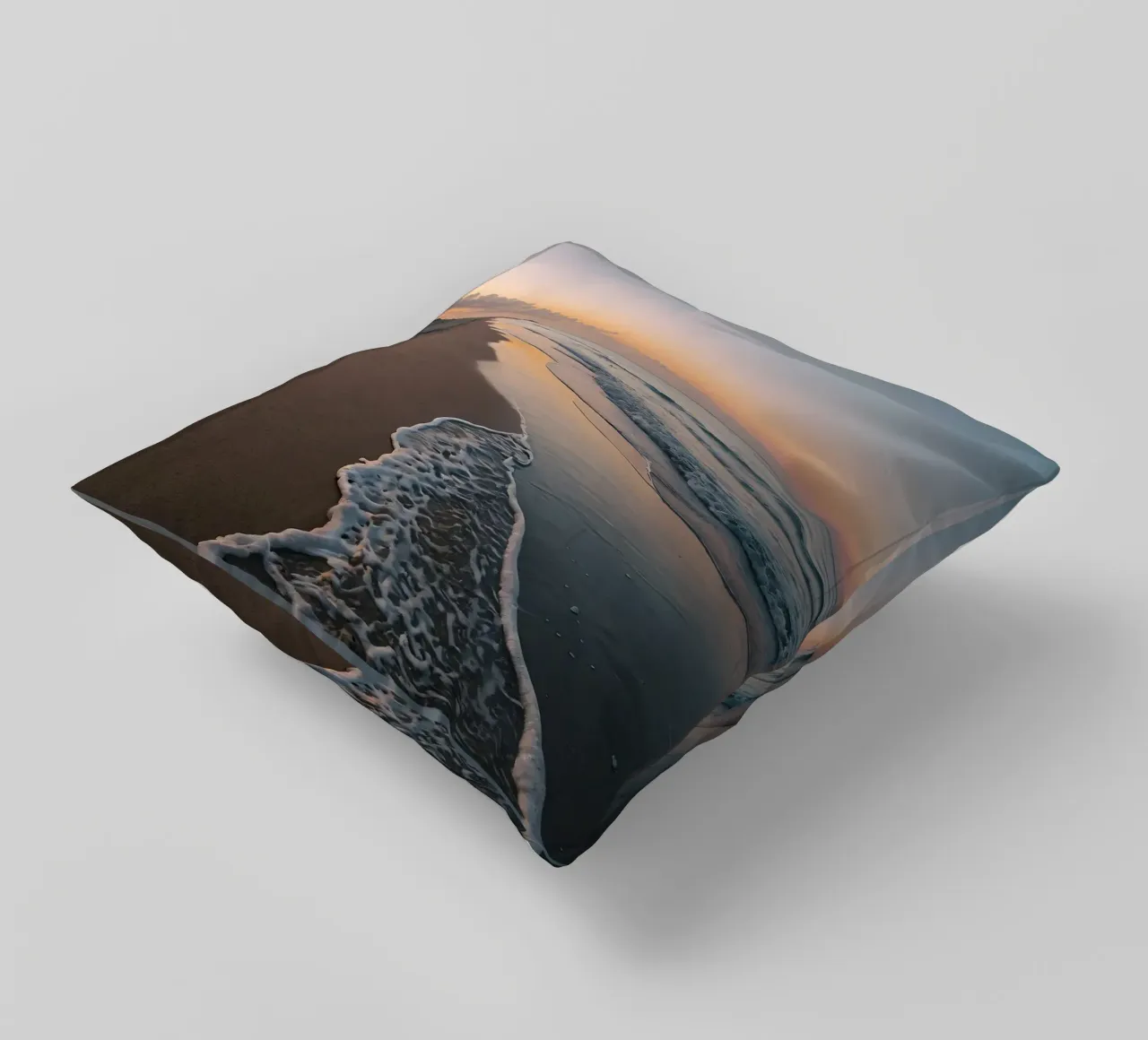 Serene beach at sunset with gentle waves lapping at the shor decorative cushion by DesignDoodle