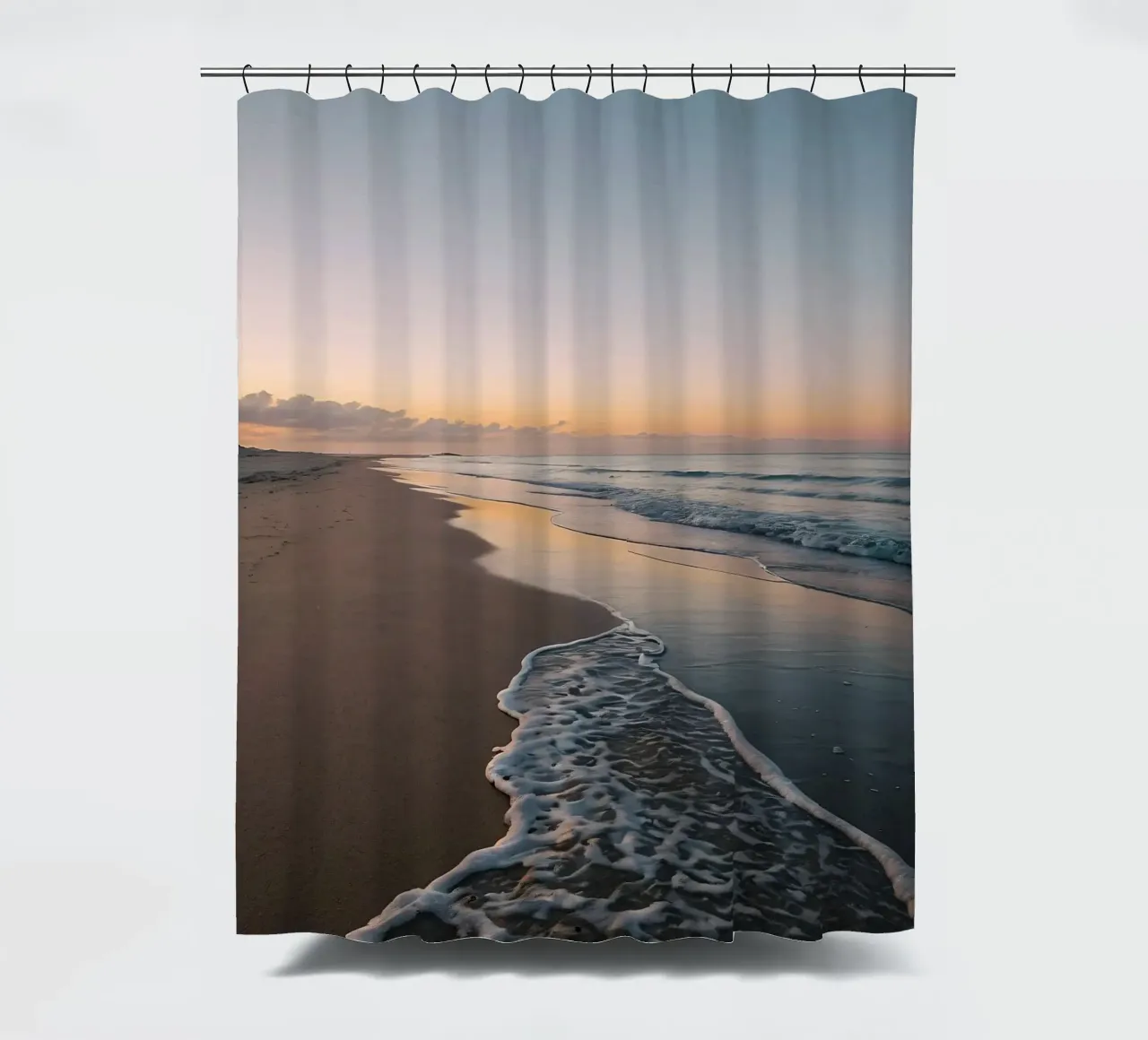 Serene beach at sunset with gentle waves lapping at the shor shower curtain by DesignDoodle