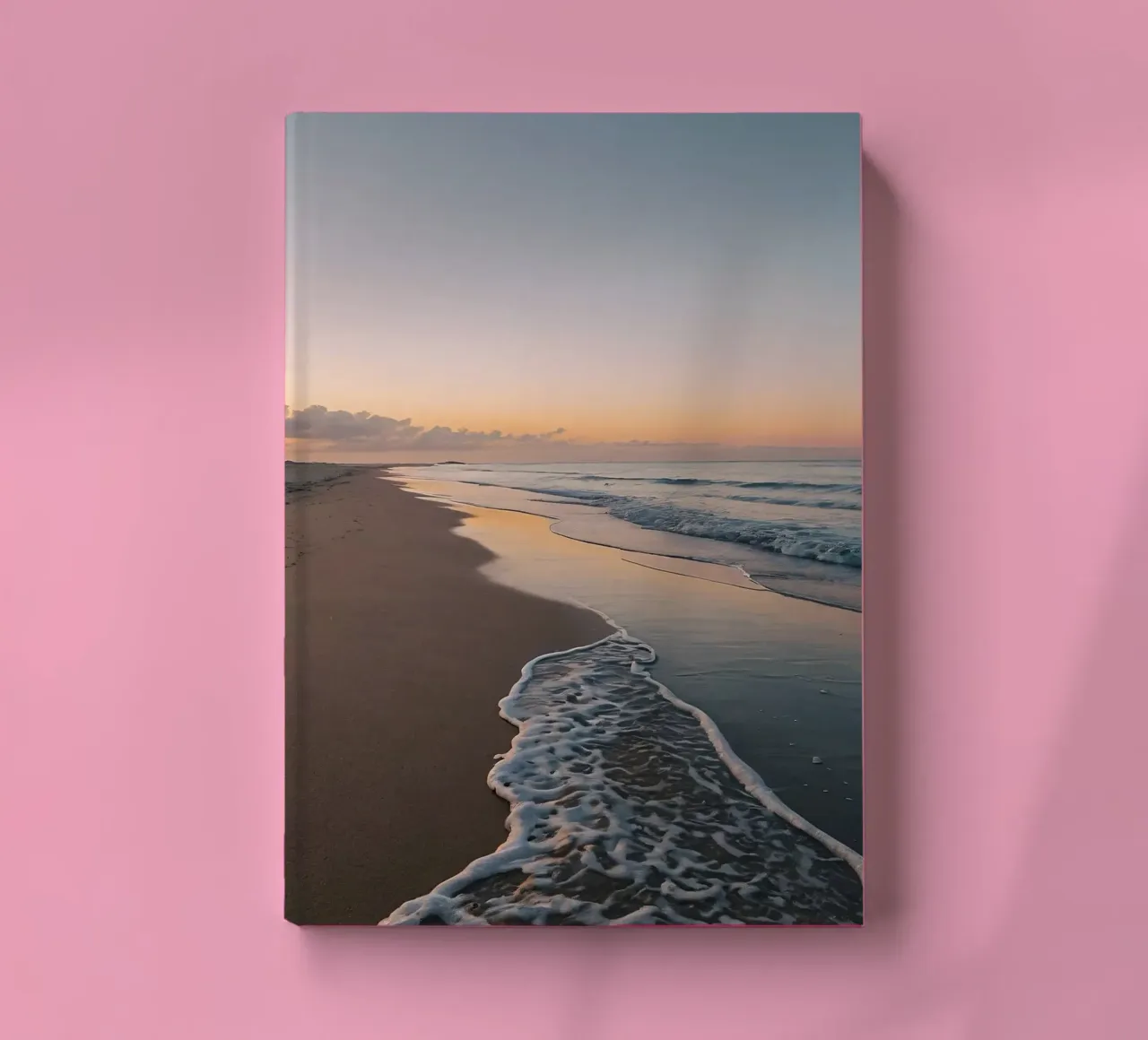 Serene beach at sunset with gentle waves lapping at the shor notebook by DesignDoodle