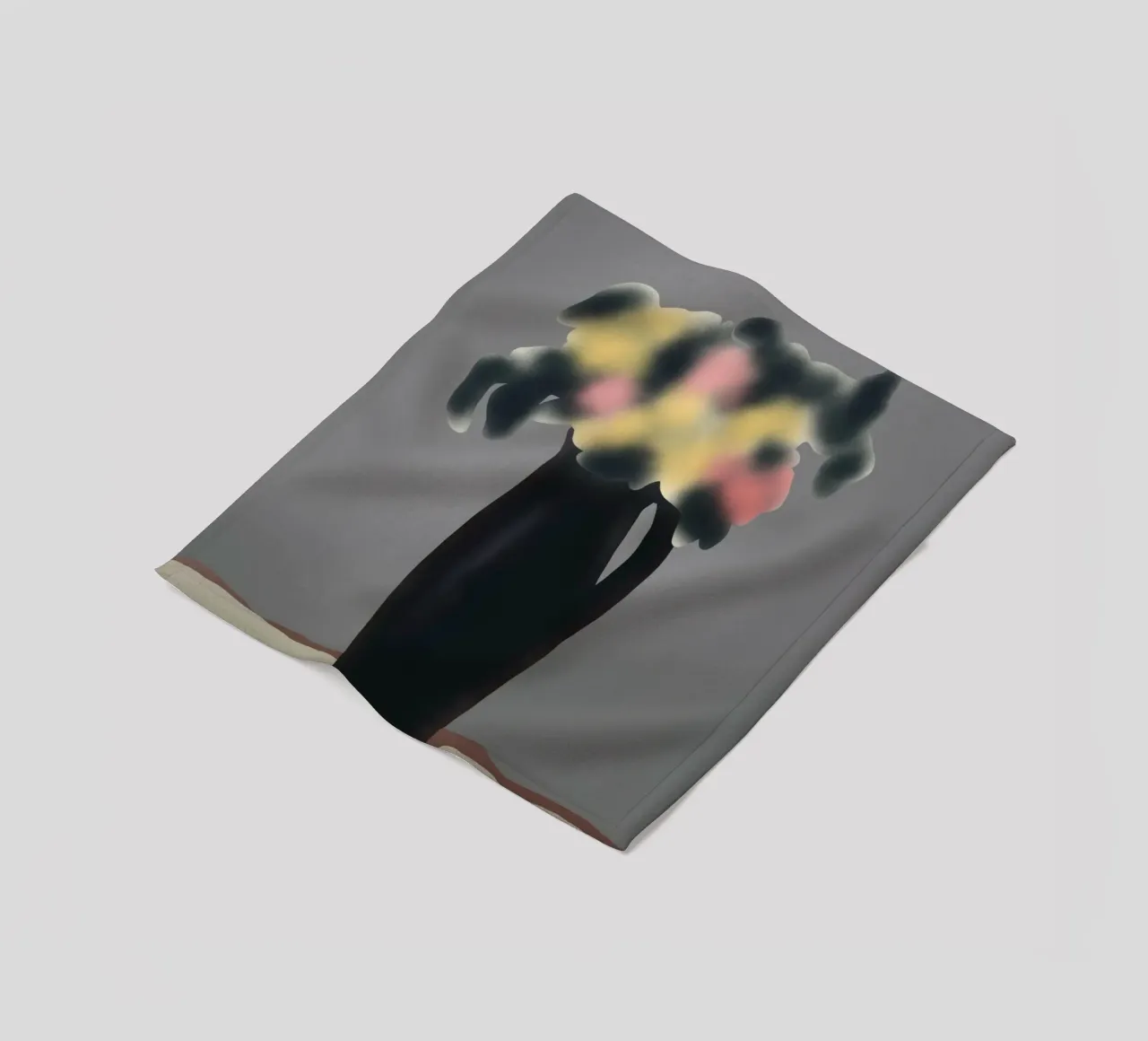 Ebony vase with blurred floral fleece blanket by Little Dean