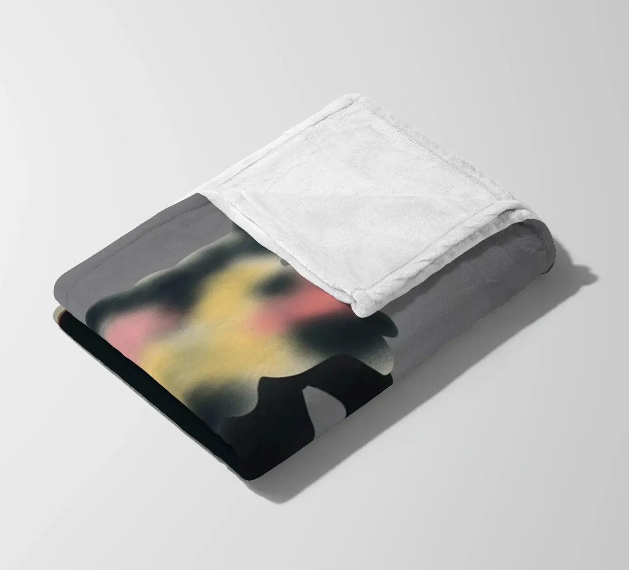 Ebony vase with blurred floral fleece blanket by Little Dean