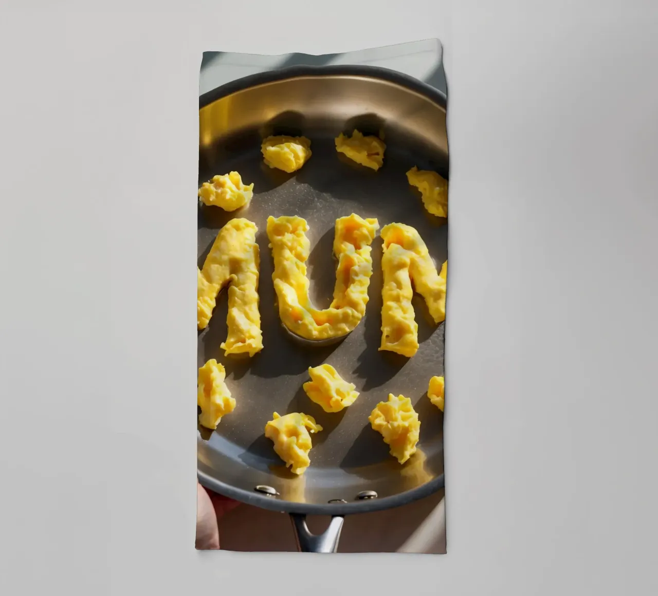 Celebrating Mum with scrambled eggs shaped into letters in a towel by DesignDoodle