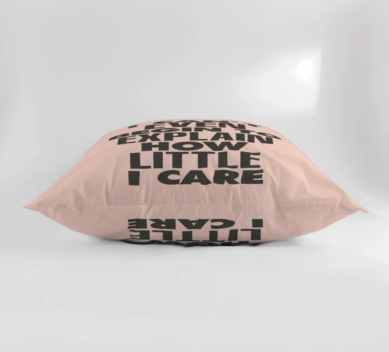 I Can't Even Begin to Explain How Little I Care in Peach decorative cushion by THE MOTIVATED TYPE