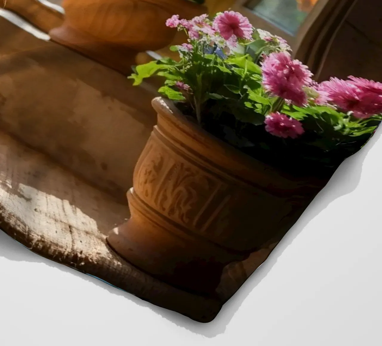 Ginger cat resting on windowsill surrounded by colorful flow fleece blanket by DesignDoodle