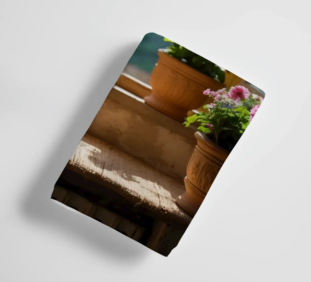 Ginger cat resting on windowsill surrounded by colorful flow towel by DesignDoodle