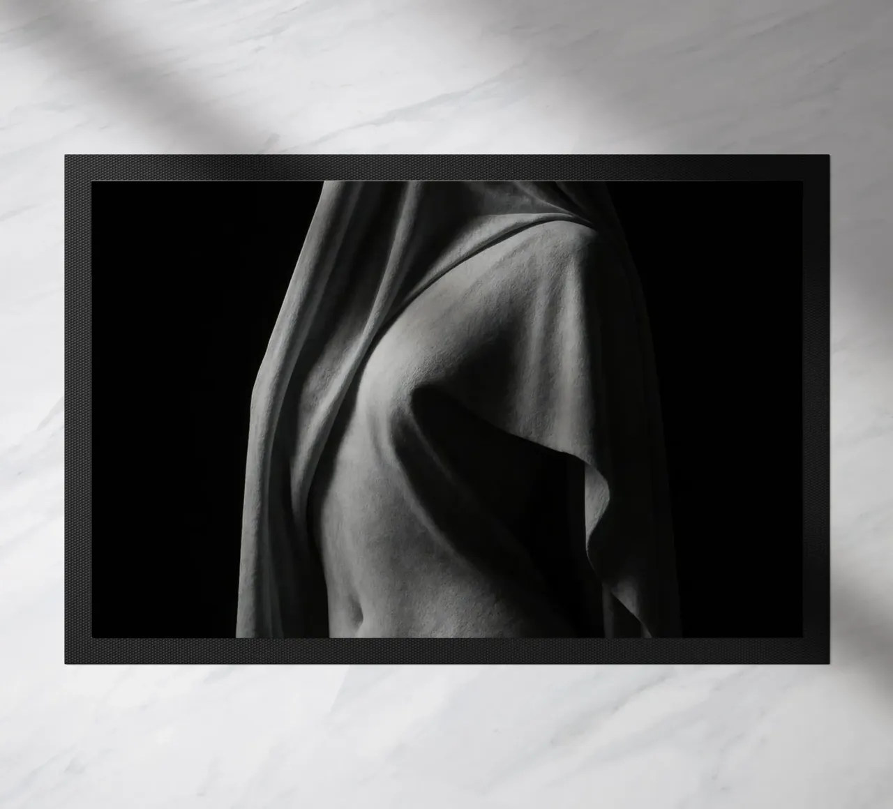 Sculpture draped in light and shadow doormat by Black & White