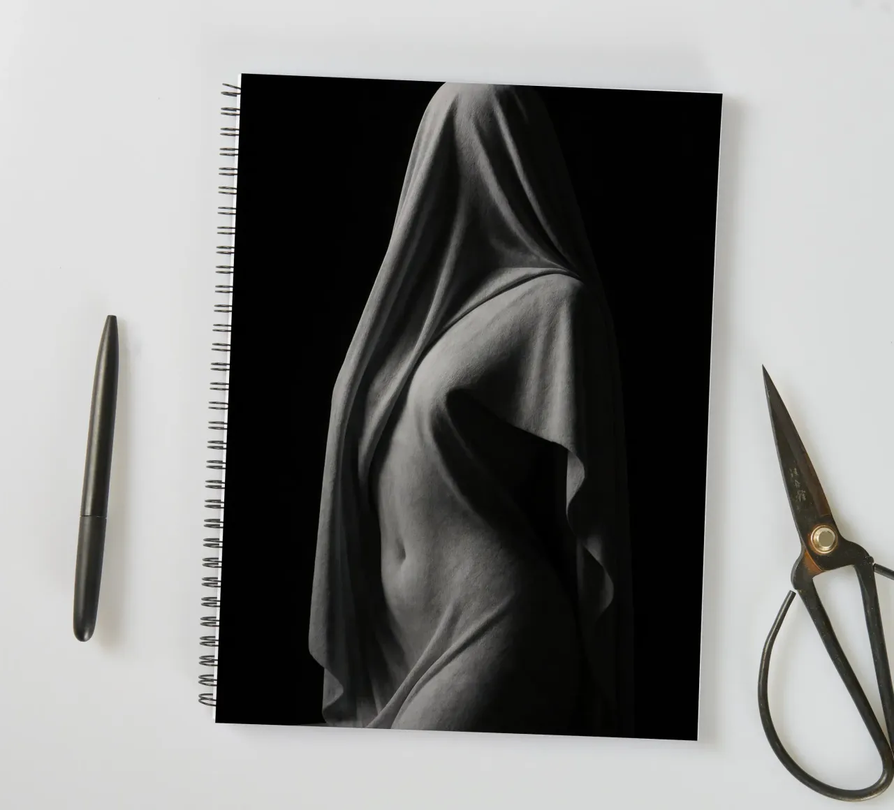 Sculpture draped in light and shadow spiral notebook by Black & White