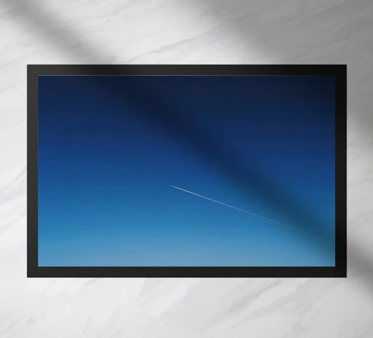 sky through doormat by Bleu