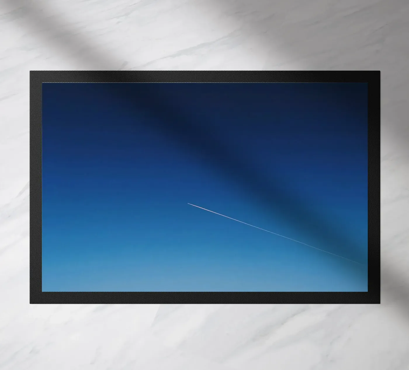 sky through doormat by Bleu