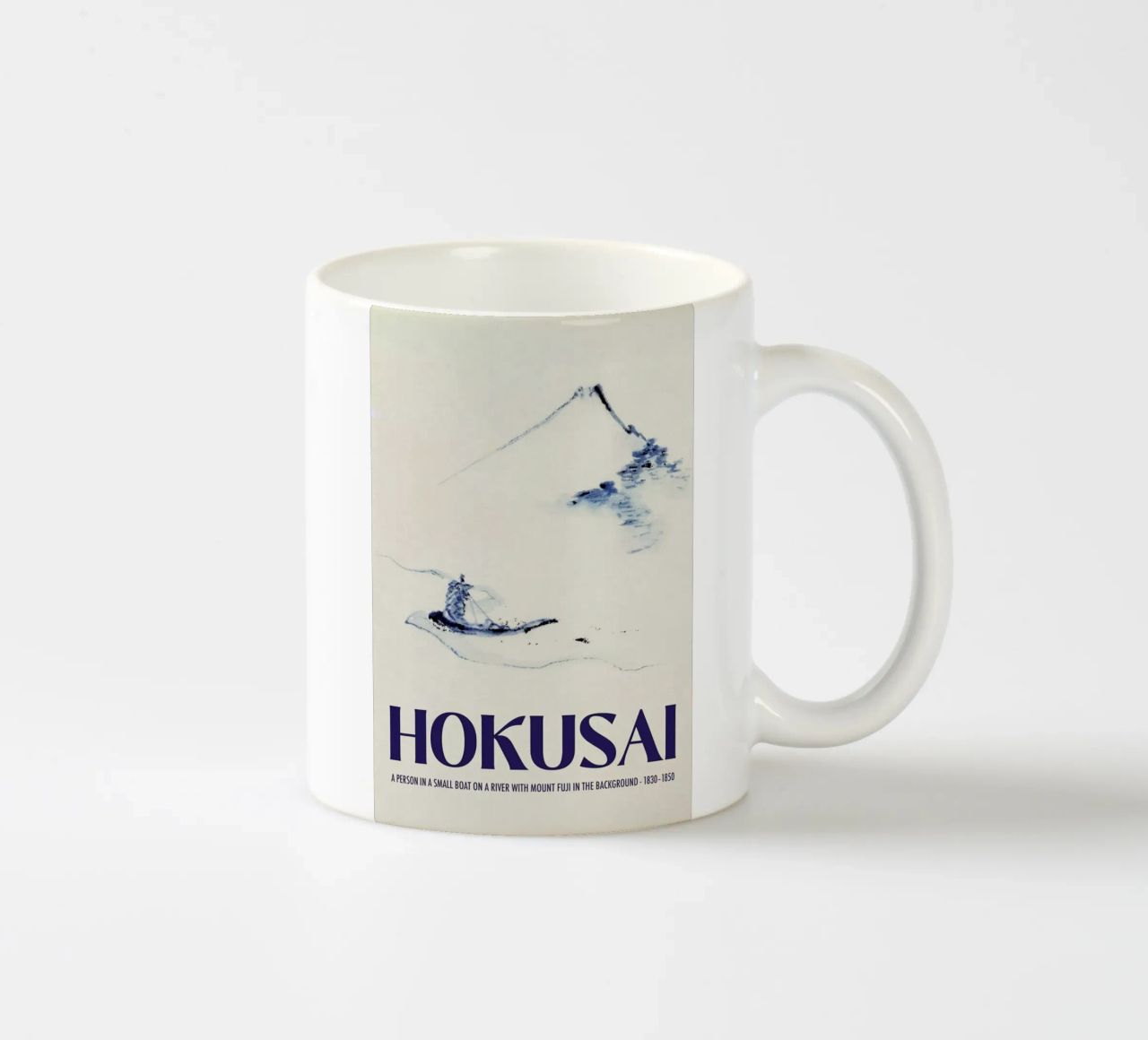 Hokusai - A Person in a Small Boat on a River with Mount Fuji in the Background III mug en céramique de Vintage by JUNIQE