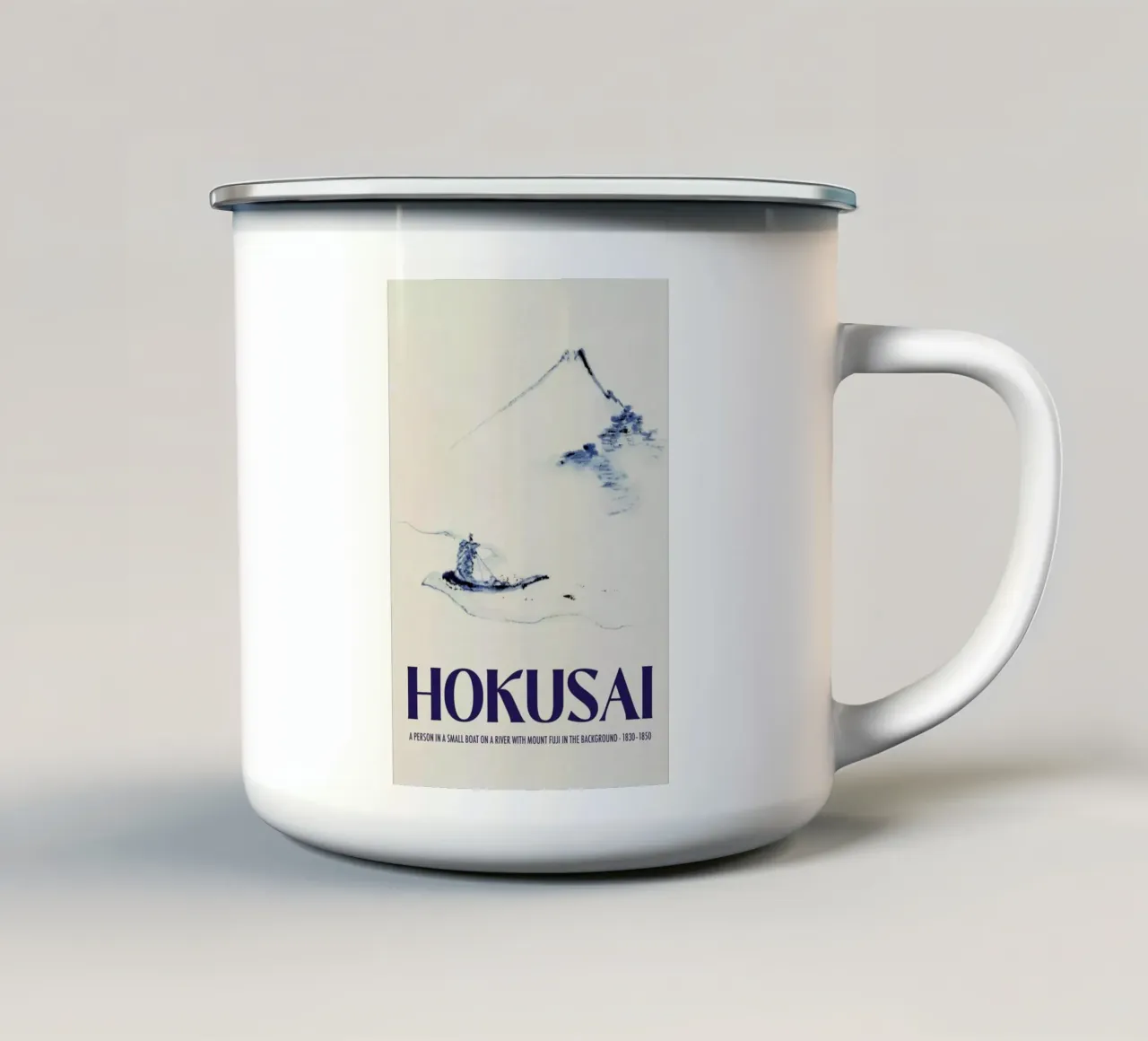 Hokusai - A Person in a Small Boat on a River with Mount Fuji in the Background III taza de esmalte de Vintage by JUNIQE