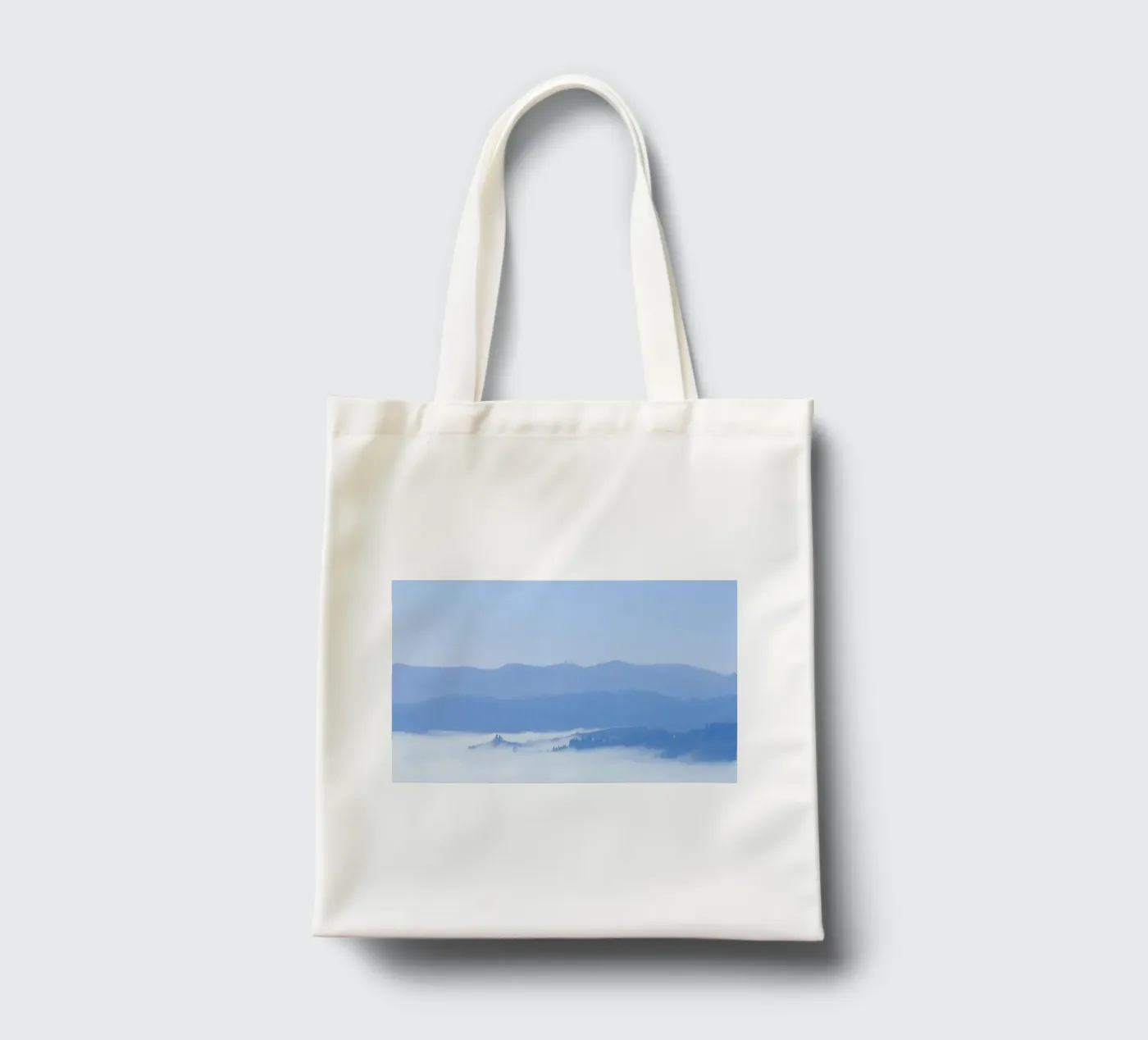 elevation clouds tote bag by Bleu