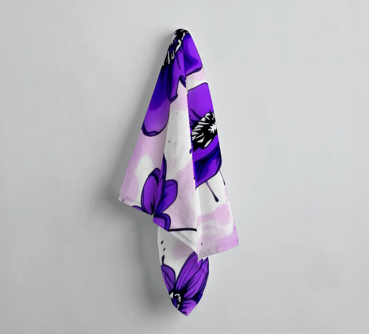 Vibrant purple flowers create a lively floral pattern towel by DesignDoodle