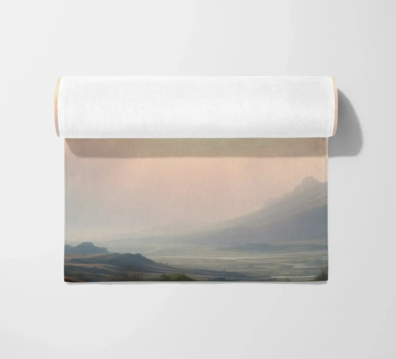 Sunlight breaks through clouds illuminating a calm valley beach towel by DesignDoodle