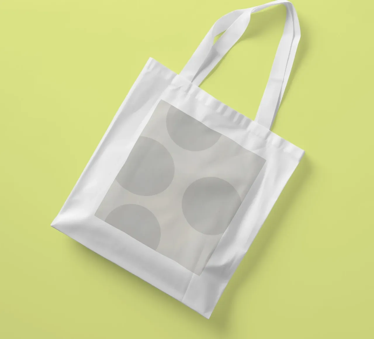 Subtle polka dot pattern on a light background tote bag by DesignDoodle
