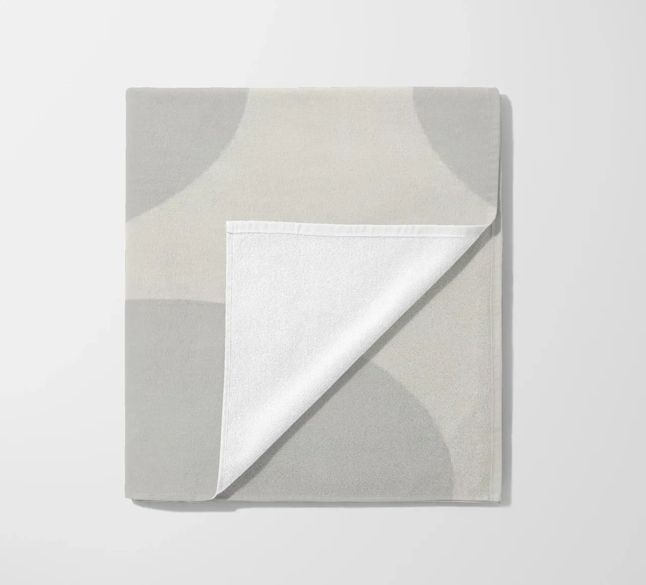 Subtle polka dot pattern on a light background beach towel by DesignDoodle