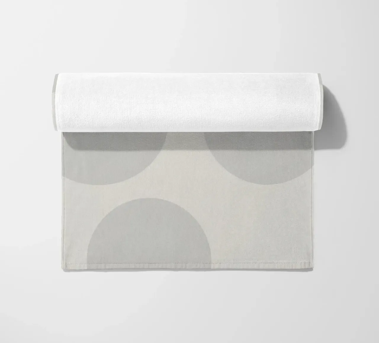 Subtle polka dot pattern on a light background beach towel by DesignDoodle