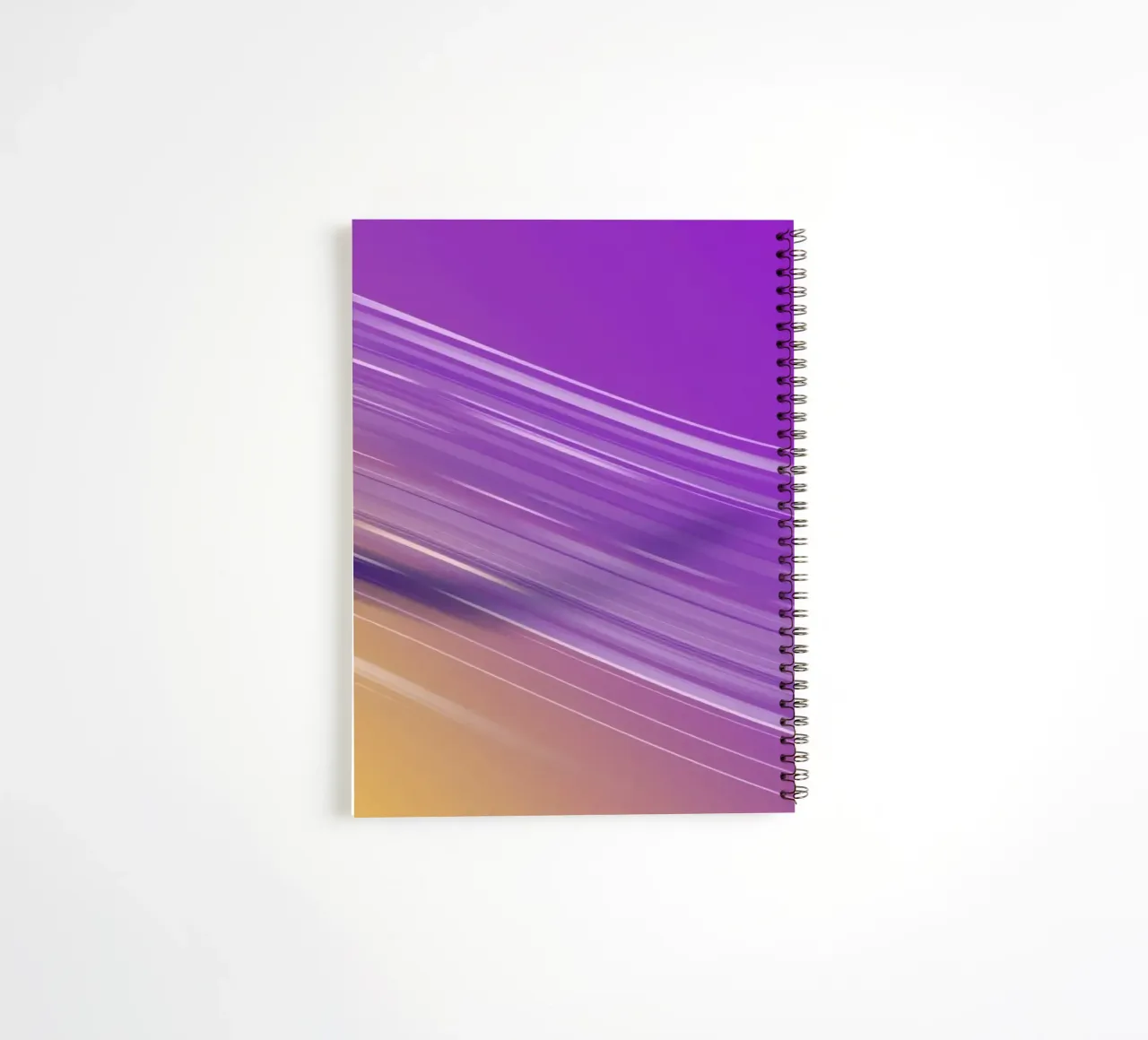 composition of smooth flowing lines in purple and yellow spiral notebook by DesignDoodle