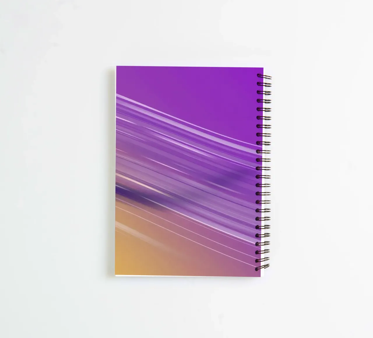 composition of smooth flowing lines in purple and yellow spiral notebook by DesignDoodle