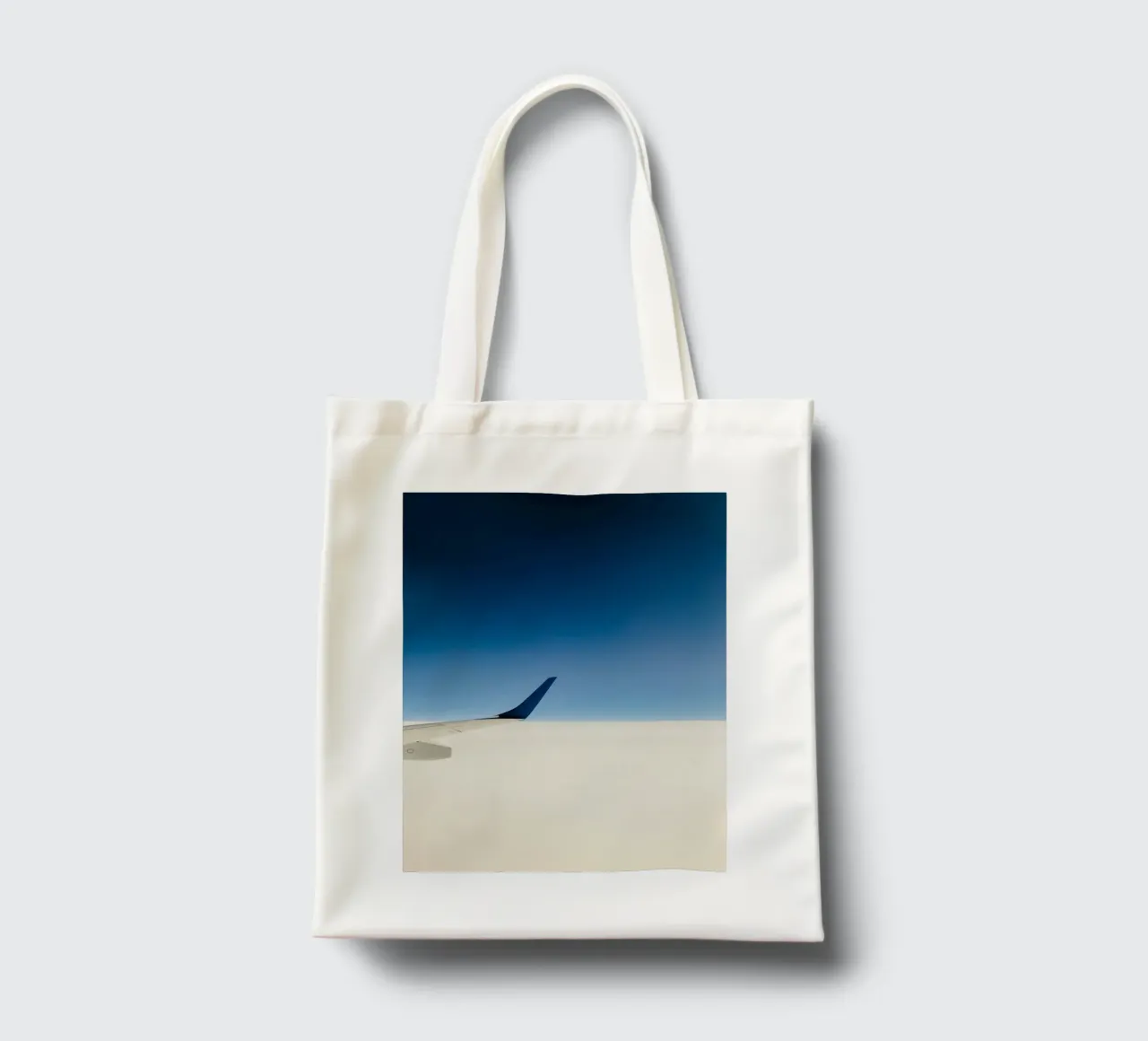airplane clouds tote bag by Bleu