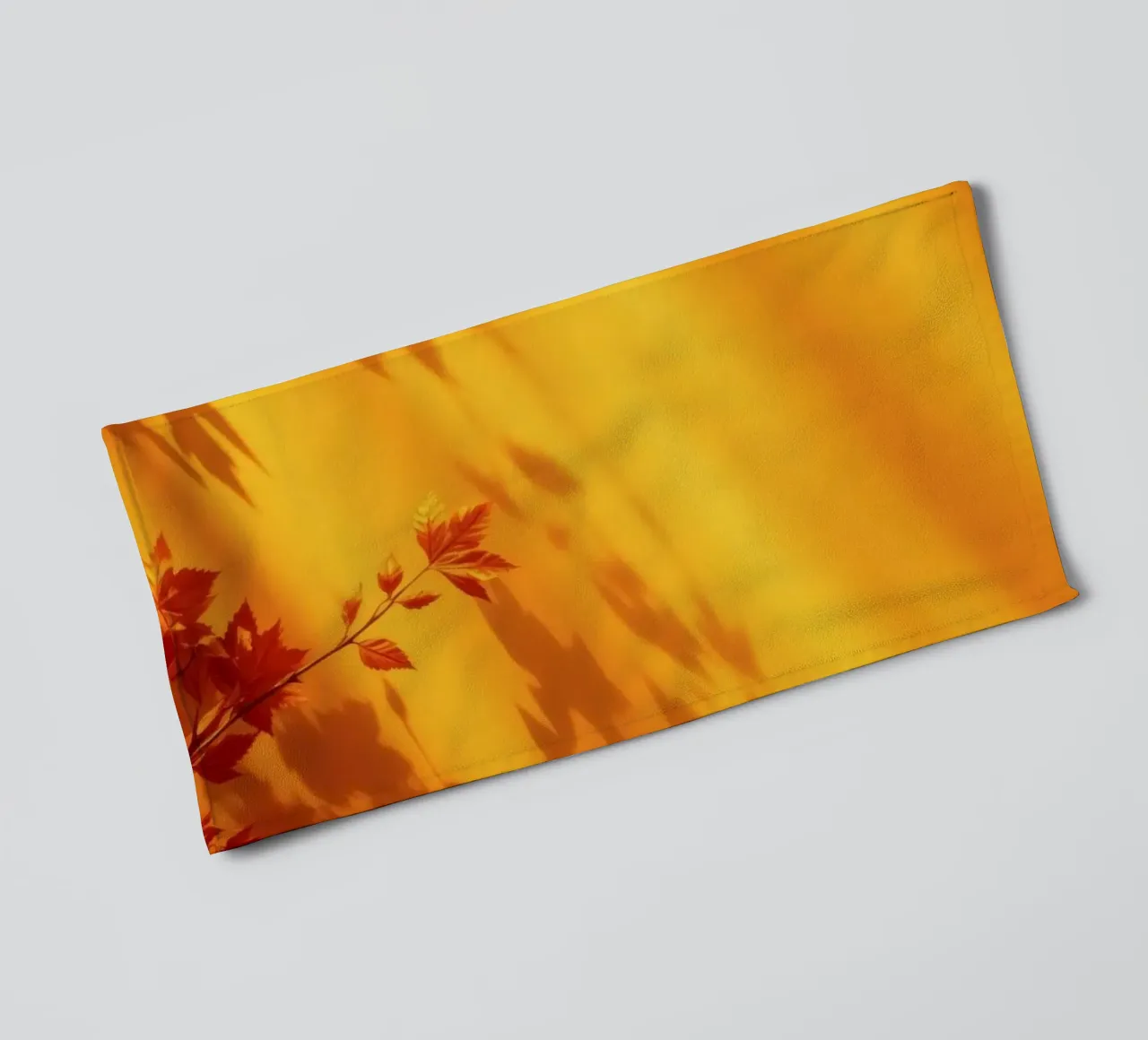 herfstbladeren werpen schaduwen op een warme gele achtergrond badhanddoek van DesignDoodle