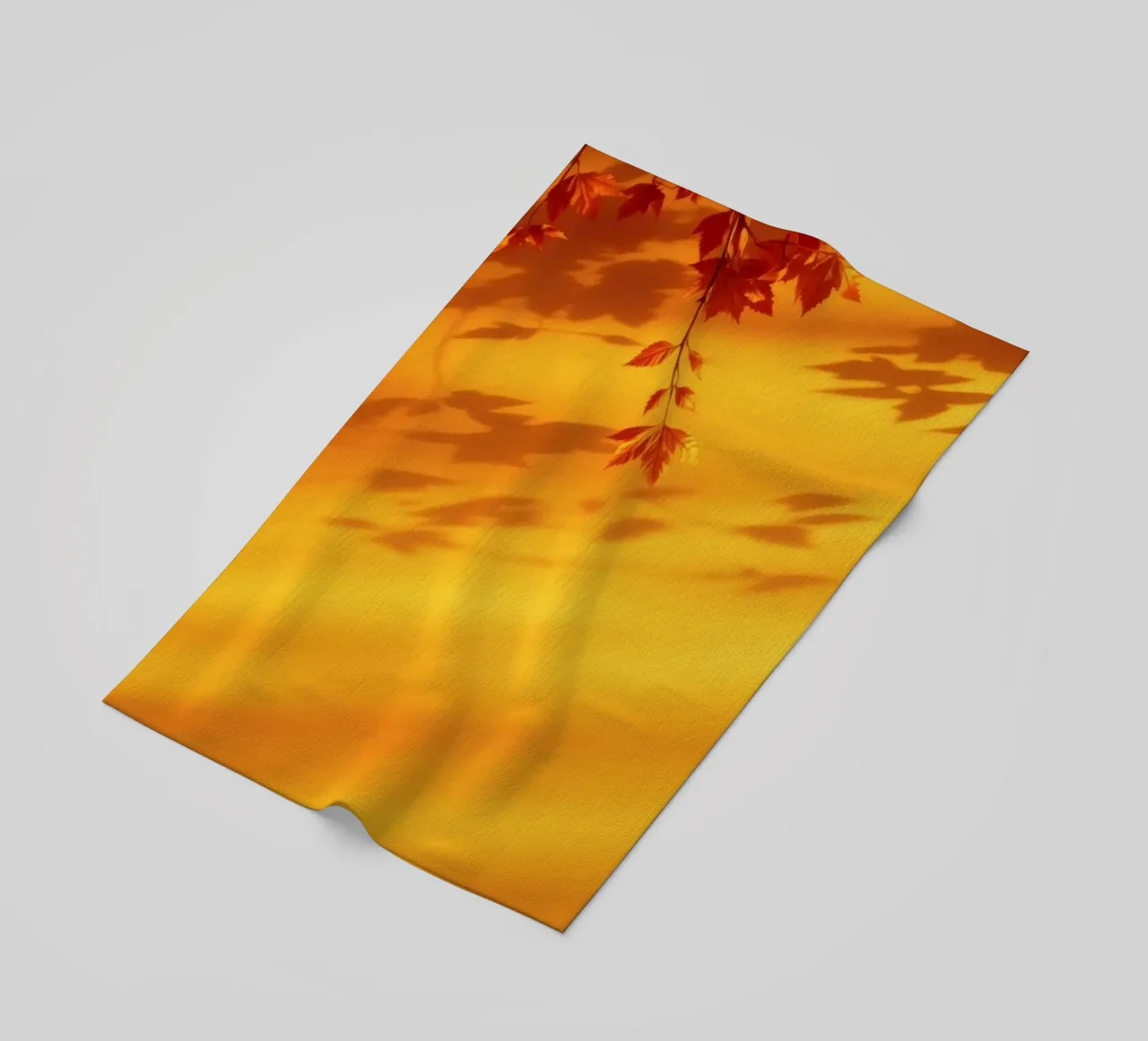 herfstbladeren werpen schaduwen op een warme gele achtergrond strandhanddoek van DesignDoodle