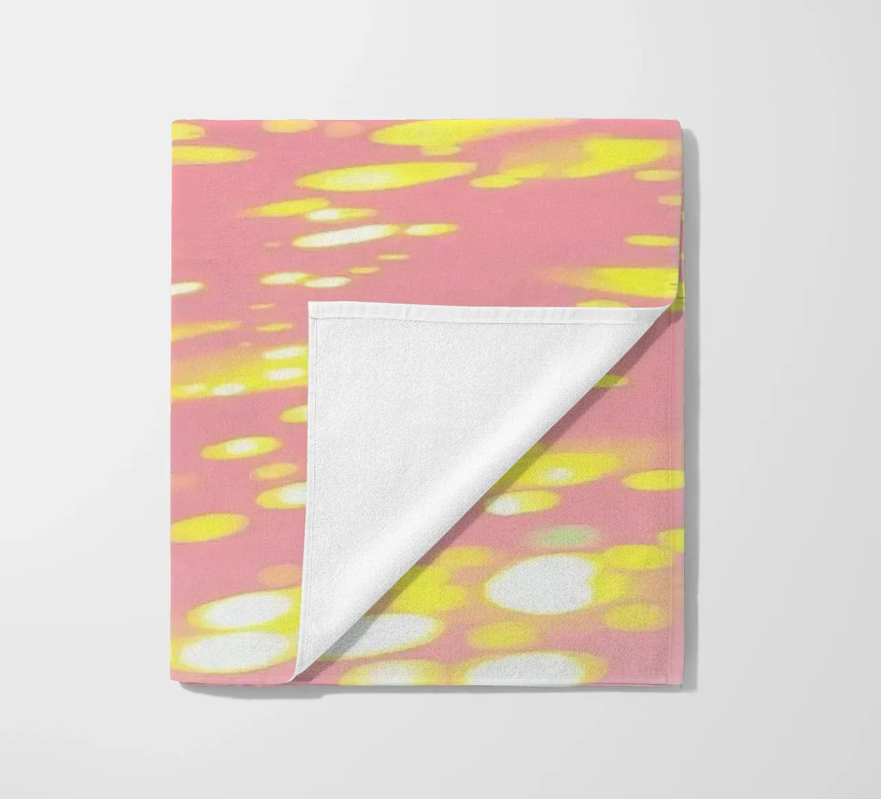 Shimmering reflections of colorful light on a soft pink art beach towel by DesignDoodle