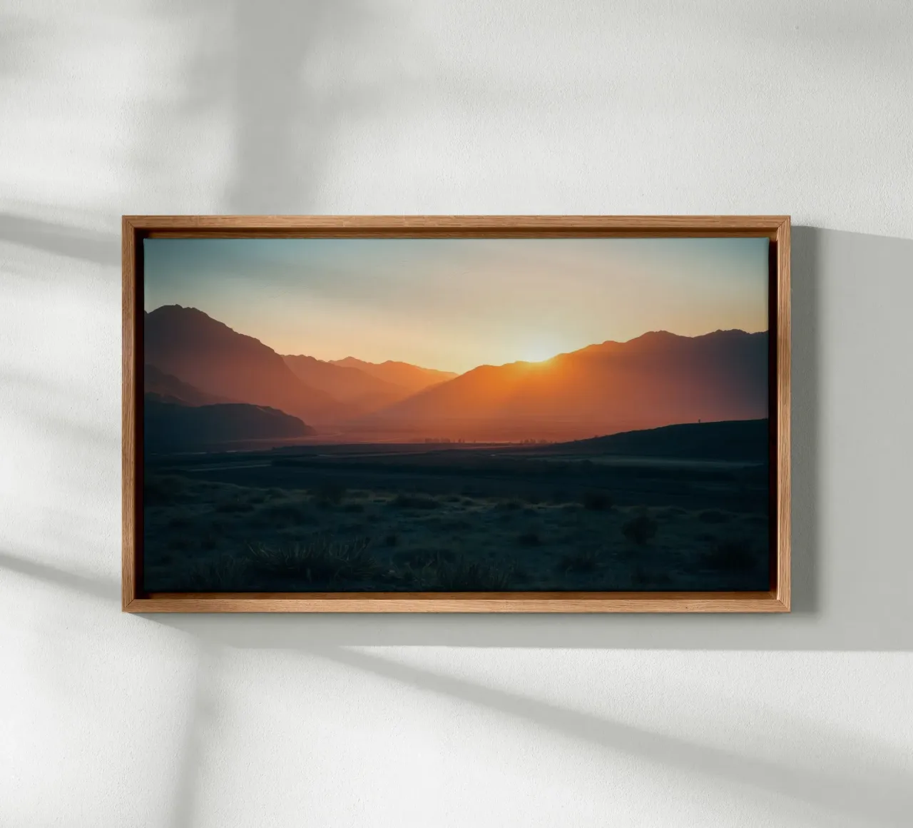 Sunset over mountains casting warm hues across the valley canvas with Floater frame by DesignDoodle