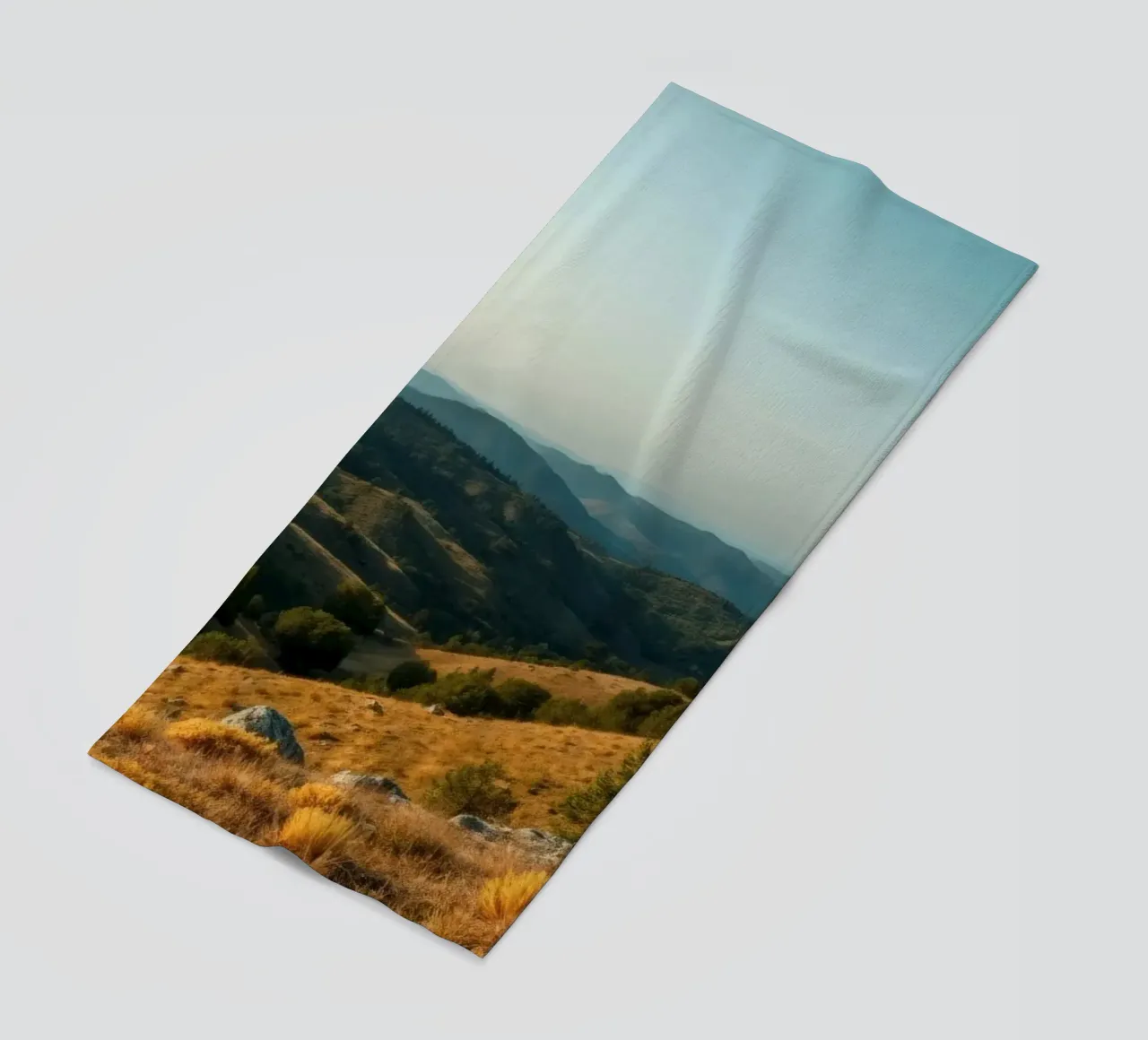 Majestic mountain landscape during late afternoon beach towel by DesignDoodle
