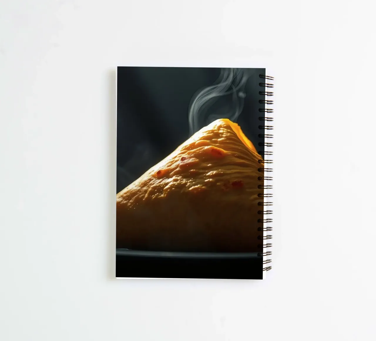 Steaming hot samosa displayed on a black plate, dark light spiral notebook by DesignDoodle