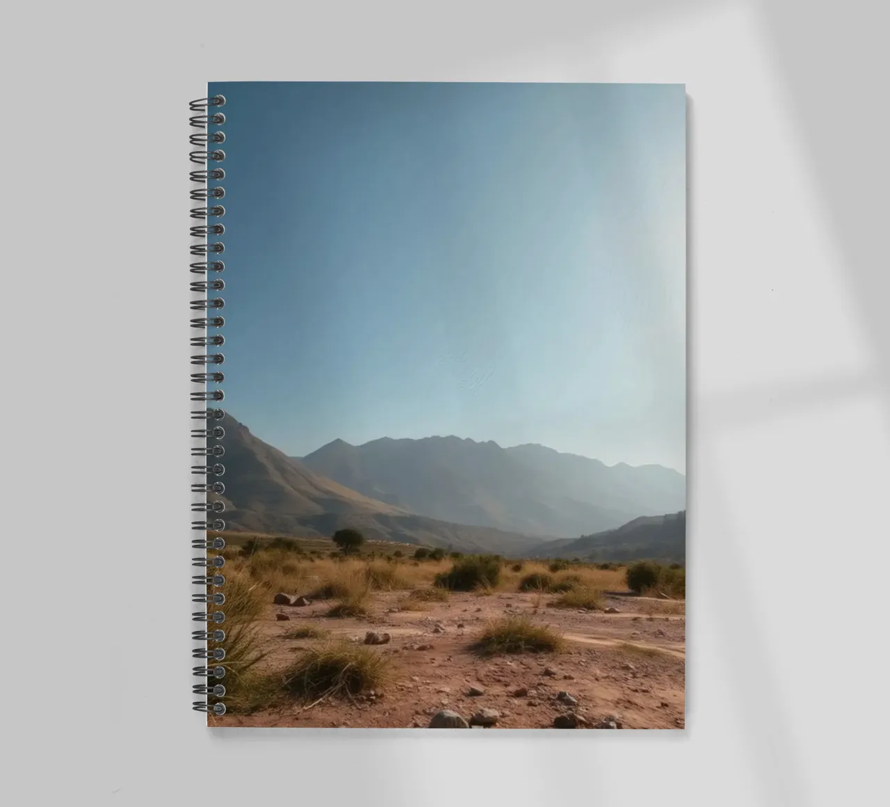 Expansive landscape view of rugged mountains & golden grass spiral notebook by DesignDoodle