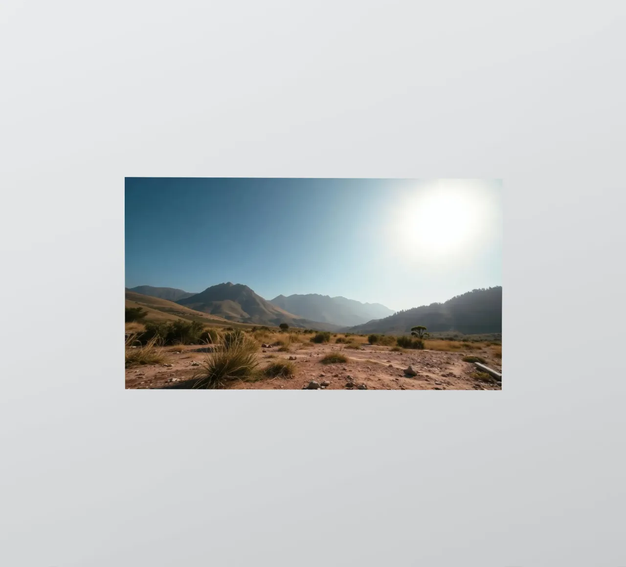 Expansive landscape view of rugged mountains & golden grass sticker by DesignDoodle