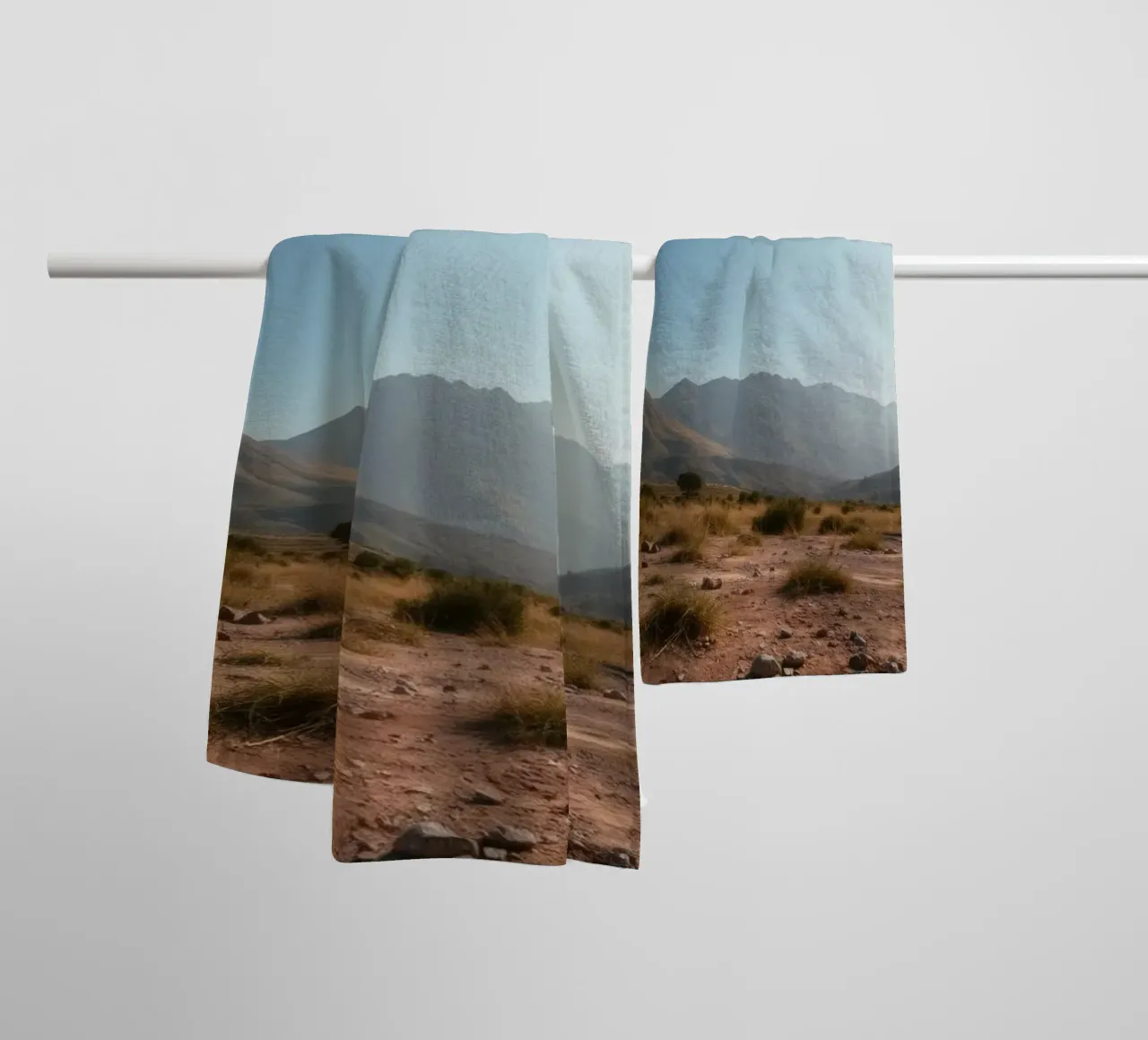 Expansive landscape view of rugged mountains & golden grass towel by DesignDoodle