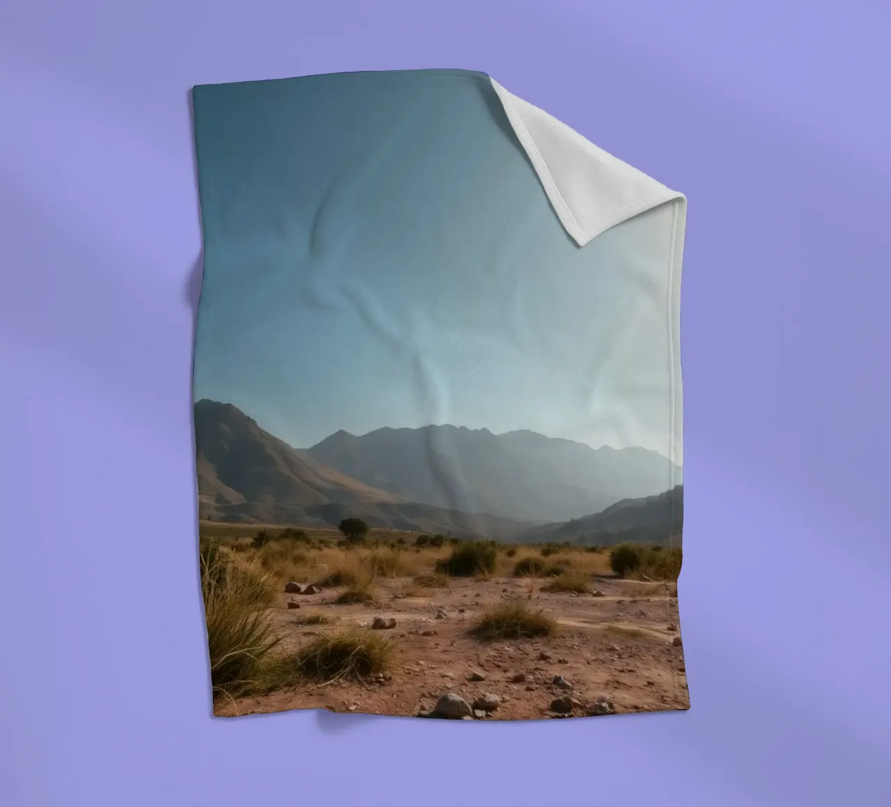 Expansive landscape view of rugged mountains & golden grass fleece blanket by DesignDoodle