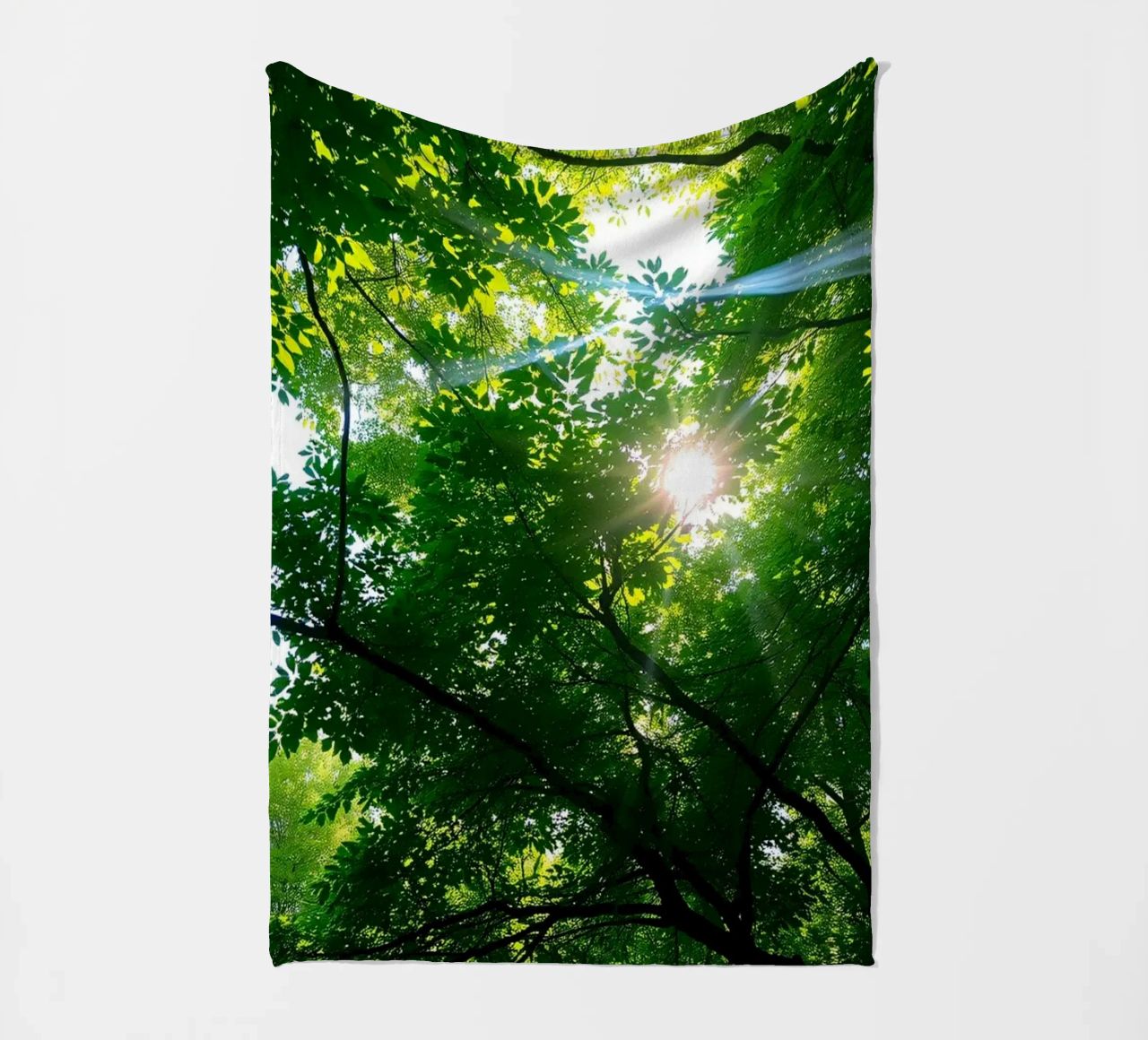 Sunlight filtering through dense green trees in calm fleece blanket by DesignDoodle
