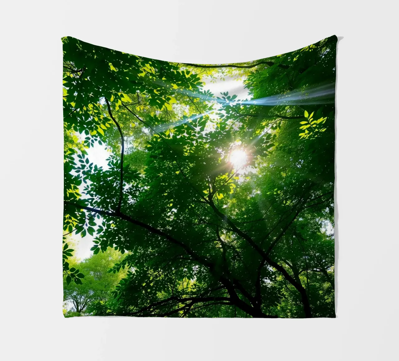 Sunlight filtering through dense green trees in calm fleece blanket by DesignDoodle
