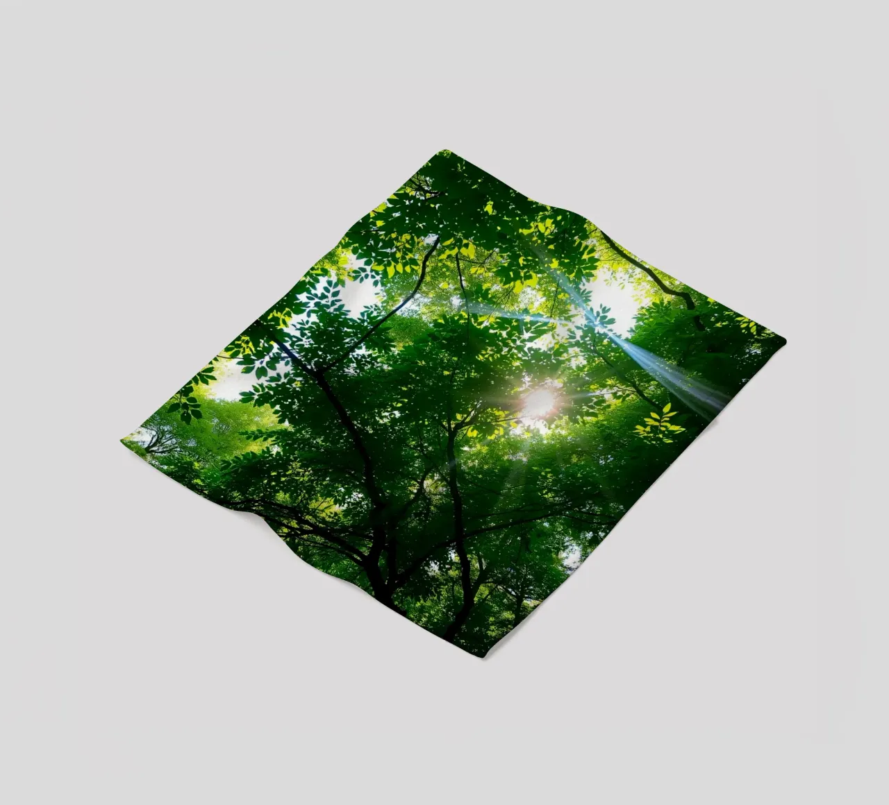 Sunlight filtering through dense green trees in calm fleece blanket by DesignDoodle