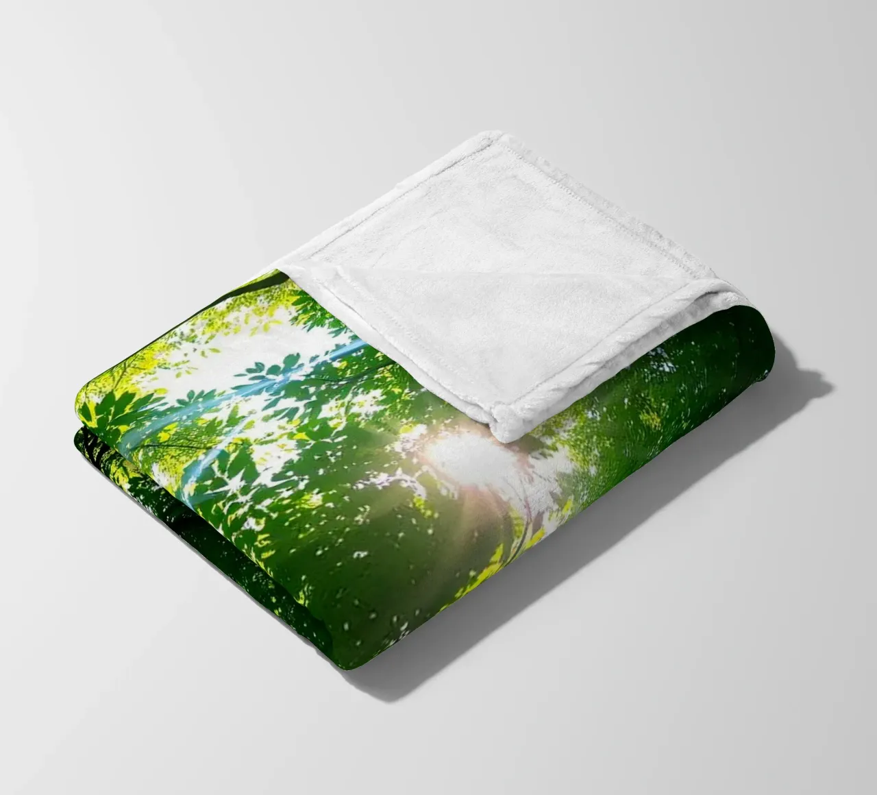 Sunlight filtering through dense green trees in calm fleece blanket by DesignDoodle