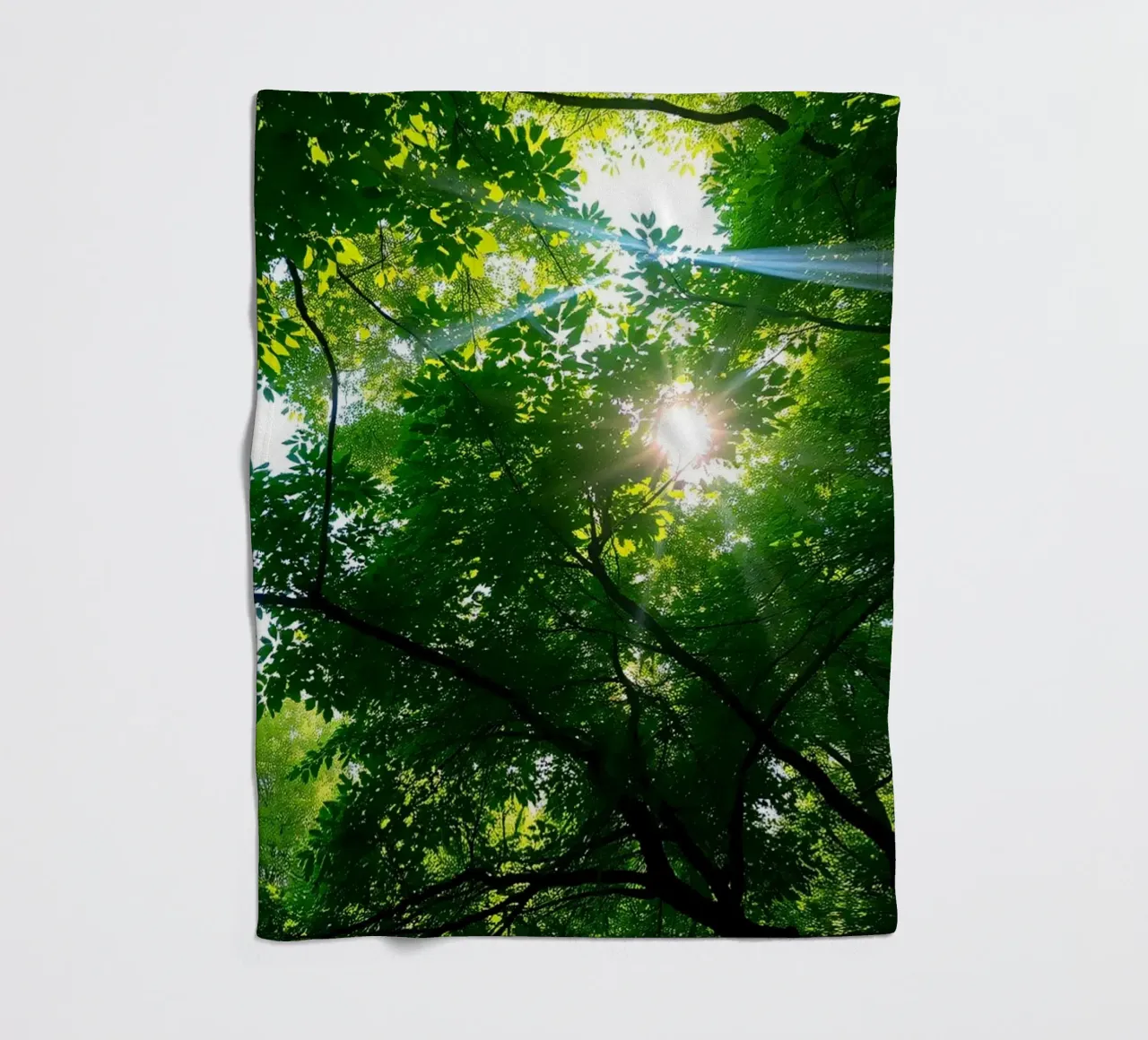 Sunlight filtering through dense green trees in calm fleece blanket by DesignDoodle