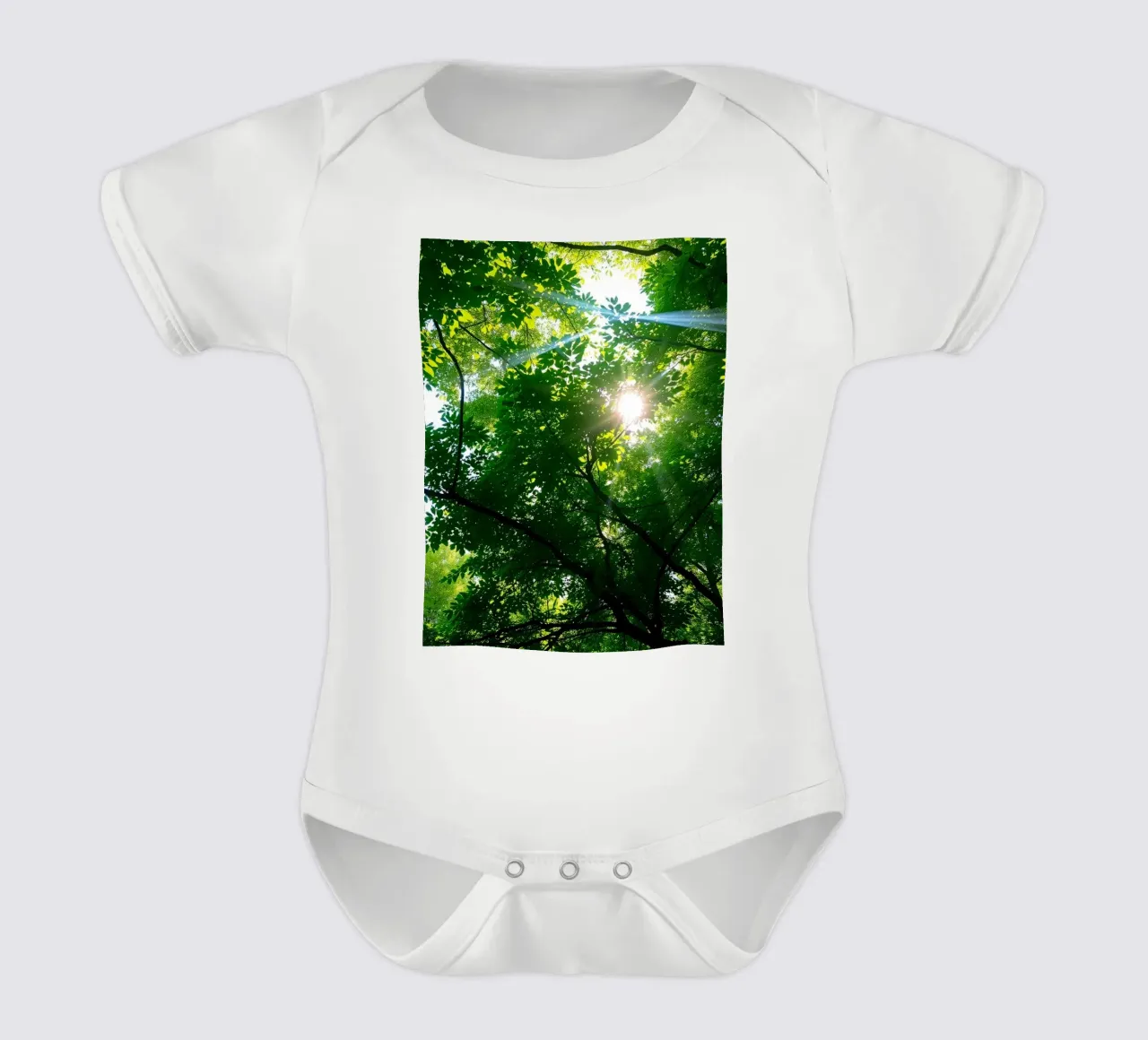 Sunlight filtering through dense green trees in calm short-sleeve baby romper by DesignDoodle