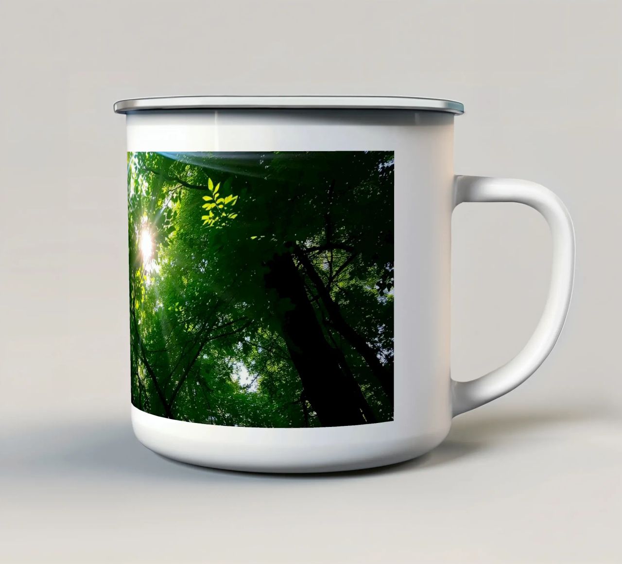Sunlight filtering through dense green trees in calm enamel mug by DesignDoodle