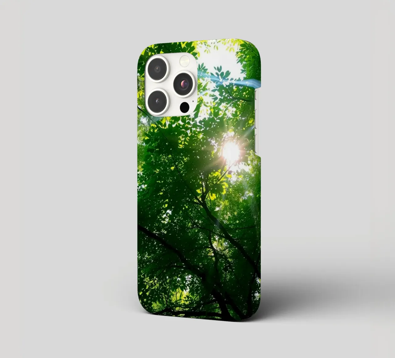 Sunlight filtering through dense green trees in calm iphone case by DesignDoodle