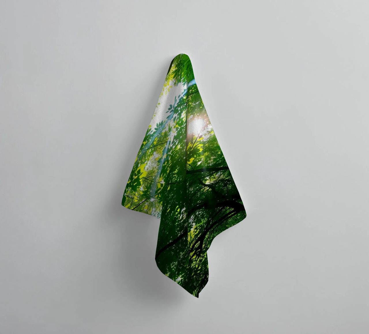 Sunlight filtering through dense green trees in calm towel by DesignDoodle