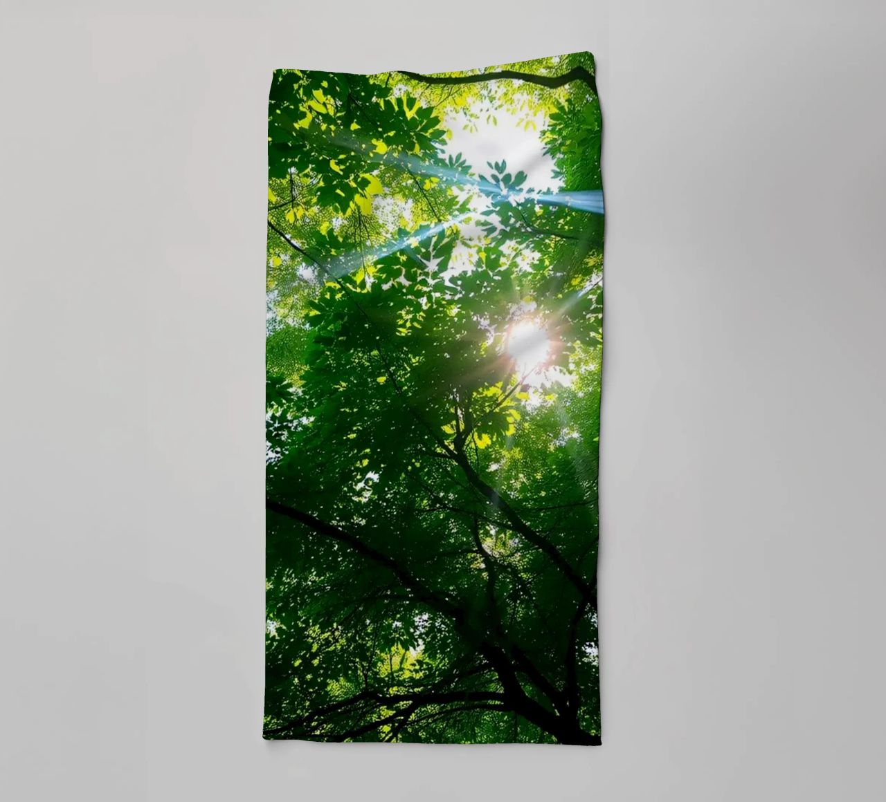 Sunlight filtering through dense green trees in calm towel by DesignDoodle