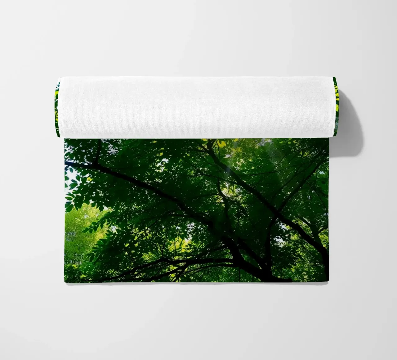 Sunlight filtering through dense green trees in calm beach towel by DesignDoodle