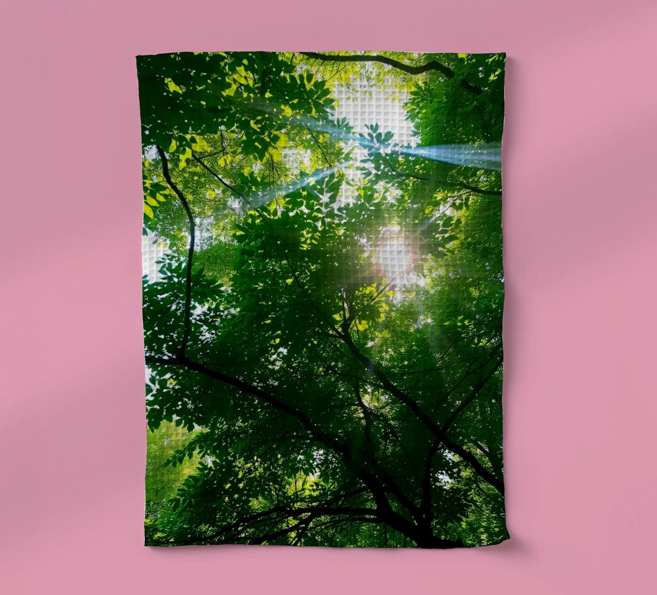 Sunlight filtering through dense green trees in calm tea towel by DesignDoodle