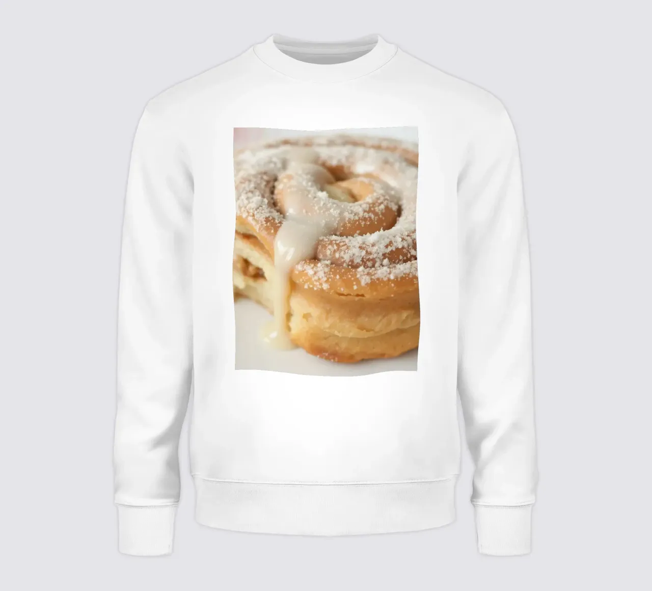 Warm cinnamon roll with cream icing and powdered sugar on a sweatshirt by DesignDoodle