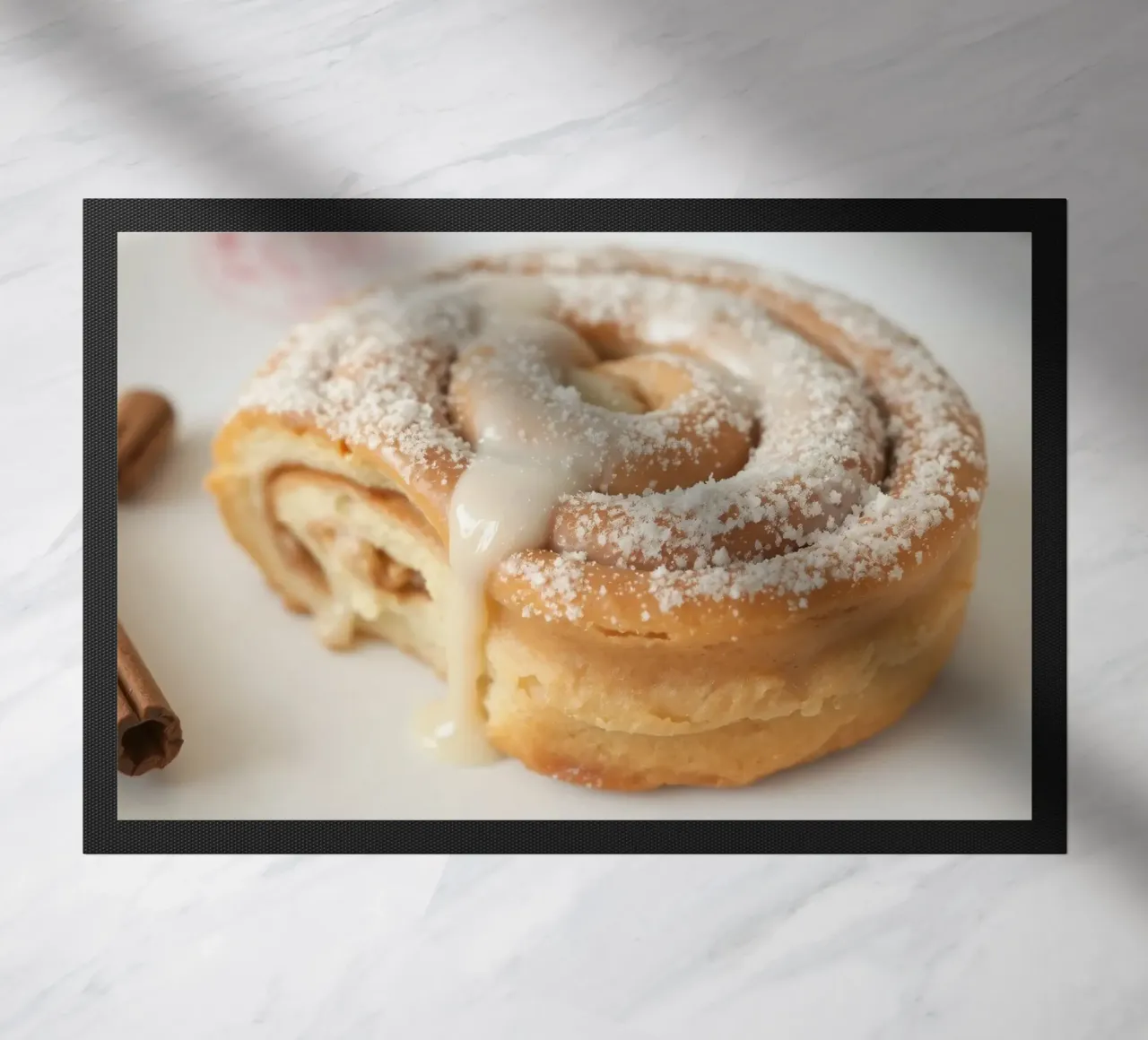 Warm cinnamon roll with cream icing and powdered sugar on a doormat by DesignDoodle