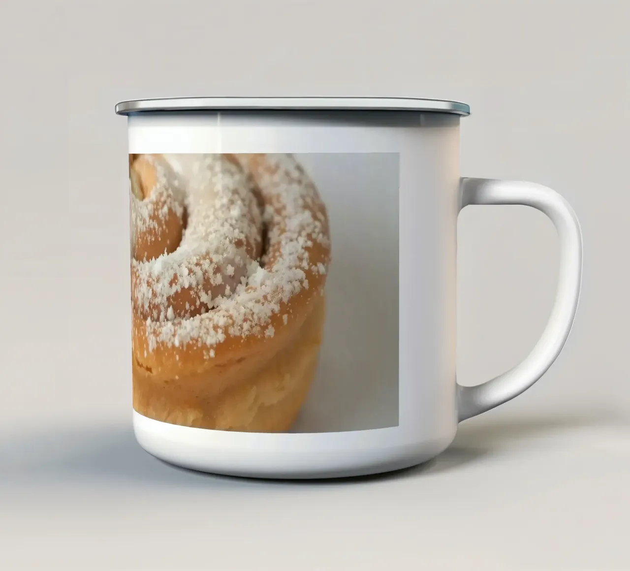 Warm cinnamon roll with cream icing and powdered sugar on a enamel mug by DesignDoodle